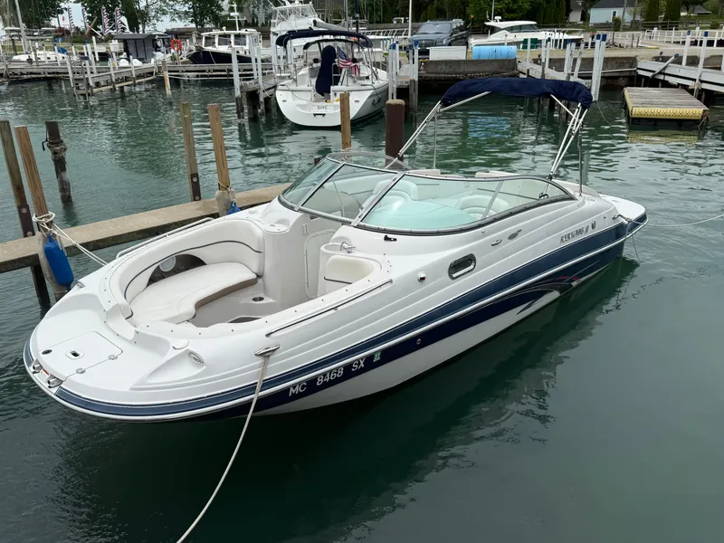 Slide: The Image of 2007 Four Winns 224 Funship boat docked in a marina. - 1
