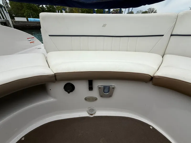 Slide: The Image of 2007 Four Winns 224 Funship boat interior with white cushioned seating. - 10