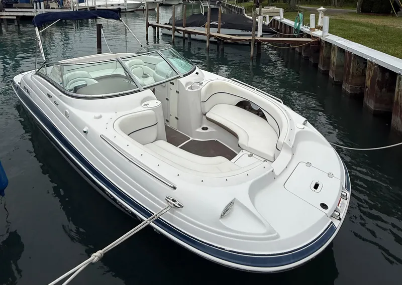 Slide: The Image of 2007 Four Winns 224 Funship boat docked in calm marina waters. - 4