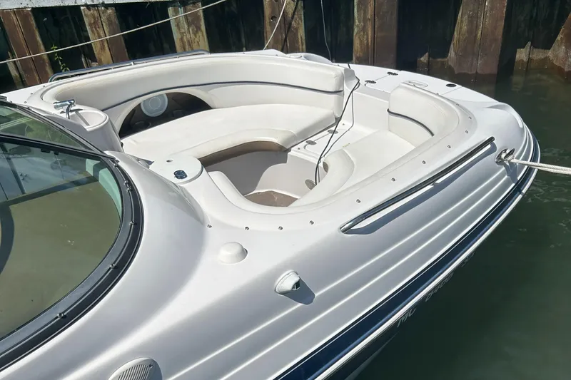 Slide: The Image of 2007 Four Winns 224 Funship boat with spacious seating, docked by wooden pier. - 5