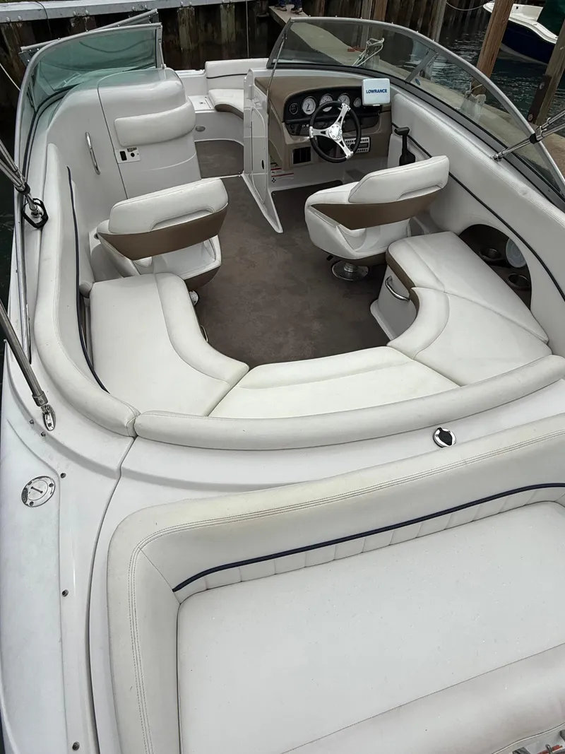 Slide: The Image of 2007 Four Winns 224 Funship boat interior with white seating and steering console. - 7
