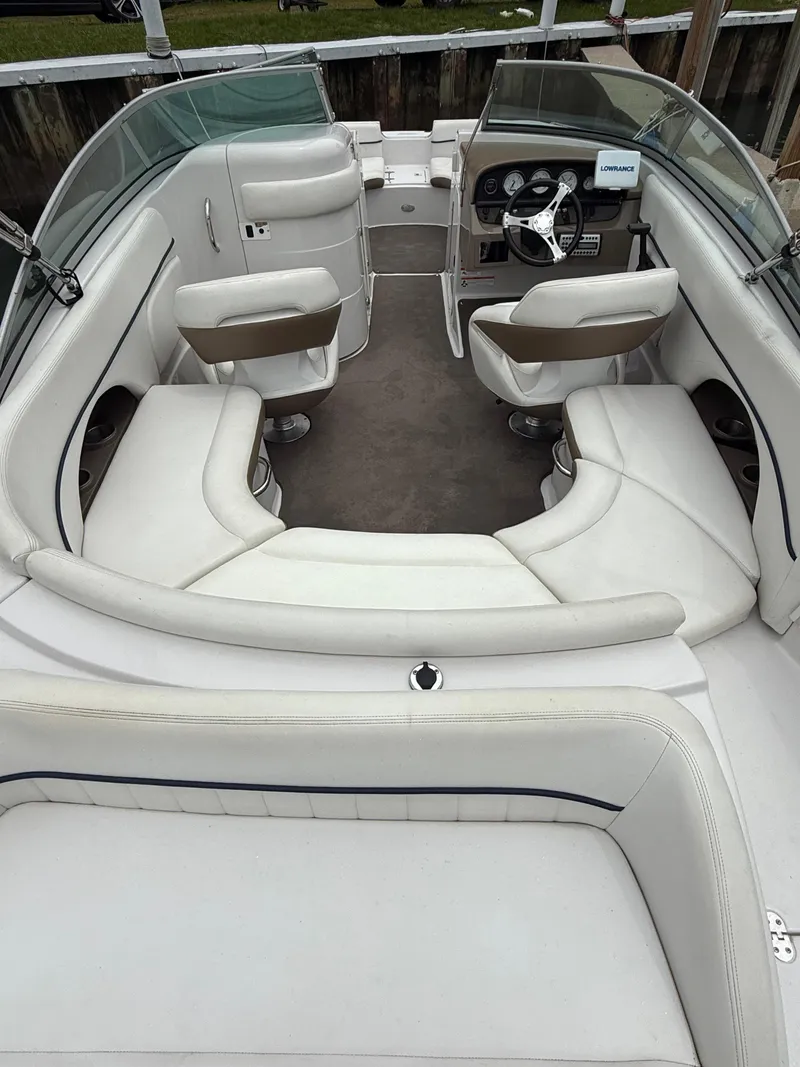Slide: The Image of 2007 Four Winns 224 Funship boat interior with white seating and dashboard. - 9