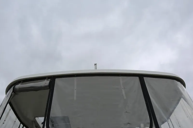 Slide: The Image of 1997 Mainship 34 Motor Yacht with overcast sky background. - 12
