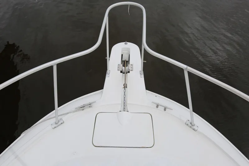 Slide: The Image of Bow view of 1997 Mainship 34 Motor Yacht with anchor and railing. - 21