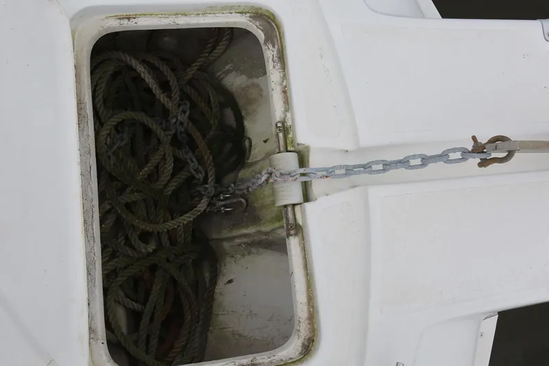 Slide: The Image of Anchor chain and rope storage on 1997 Mainship 34 Motor Yacht. - 22