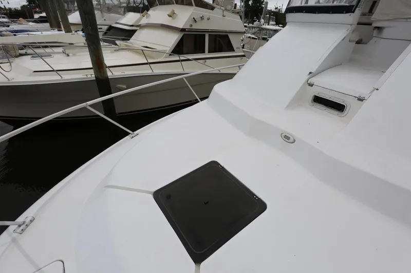 Slide: The Image of 1997 Mainship 34 Motor Yacht deck view at marina. - 27