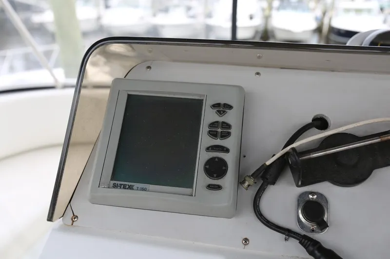Slide: The Image of 1997 Mainship 34 Motor Yacht dashboard with navigation equipment and controls. - 32