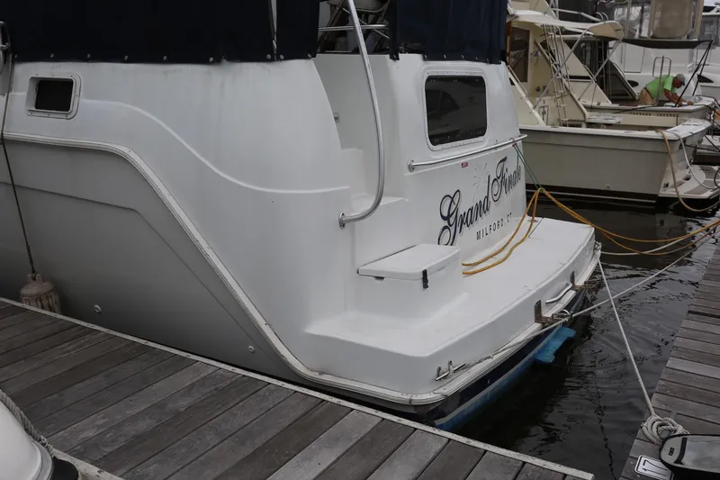 Slide: The Image of 1997 Mainship 34 Motor Yacht docked at marina. - 4