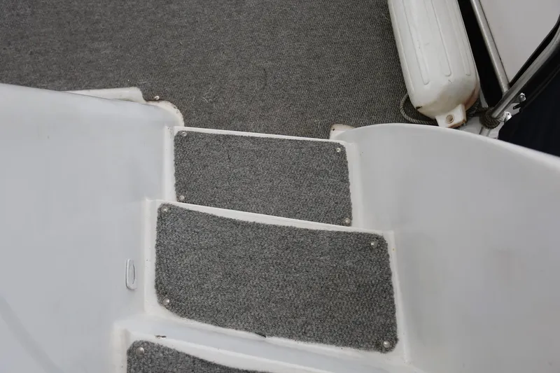 Slide: The Image of Steps with gray carpet on a 1997 Mainship 34 Motor Yacht. - 46