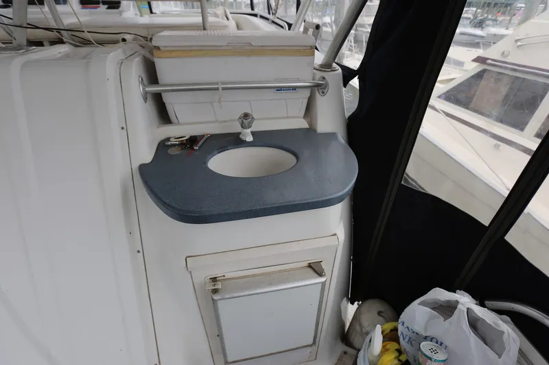 Slide: The Image of 1997 Mainship 34 Motor Yacht interior with sink and storage area. - 47