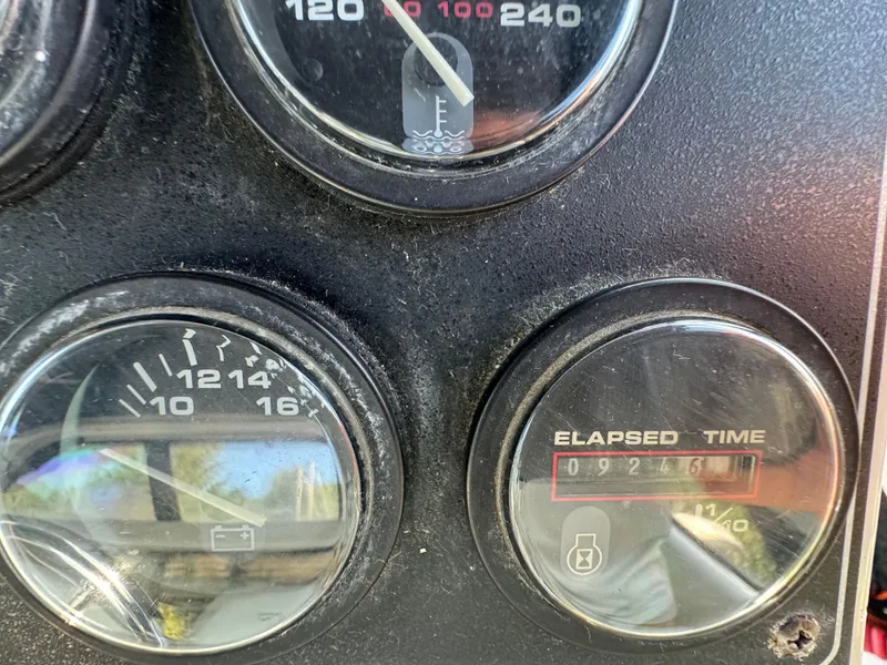 Slide: The Image of Close-up of 1991 Carver 33 Aft Cabin gauges showing temperature, voltage, and elapsed time. - 14