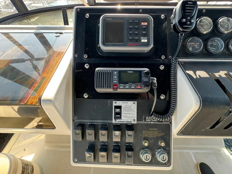 Slide: The Image of Control panel of a 1991 Carver 33 Aft Cabin boat with navigation equipment. - 16