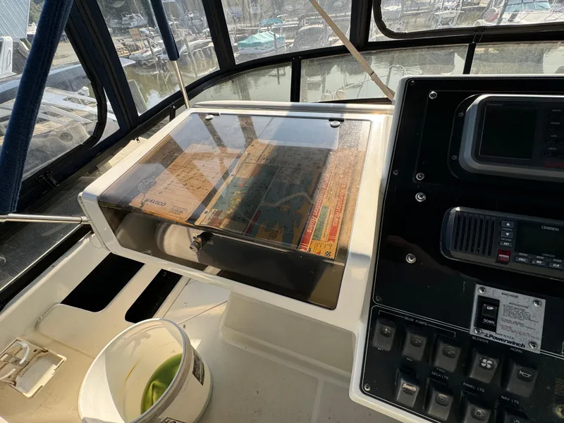 Slide: The Image of 1991 Carver 33 Aft Cabin helm with navigation equipment and chart display. - 17