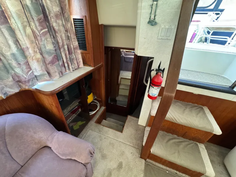 Slide: The Image of Interior of 1991 Carver 33 Aft Cabin with stairs and seating area. - 31
