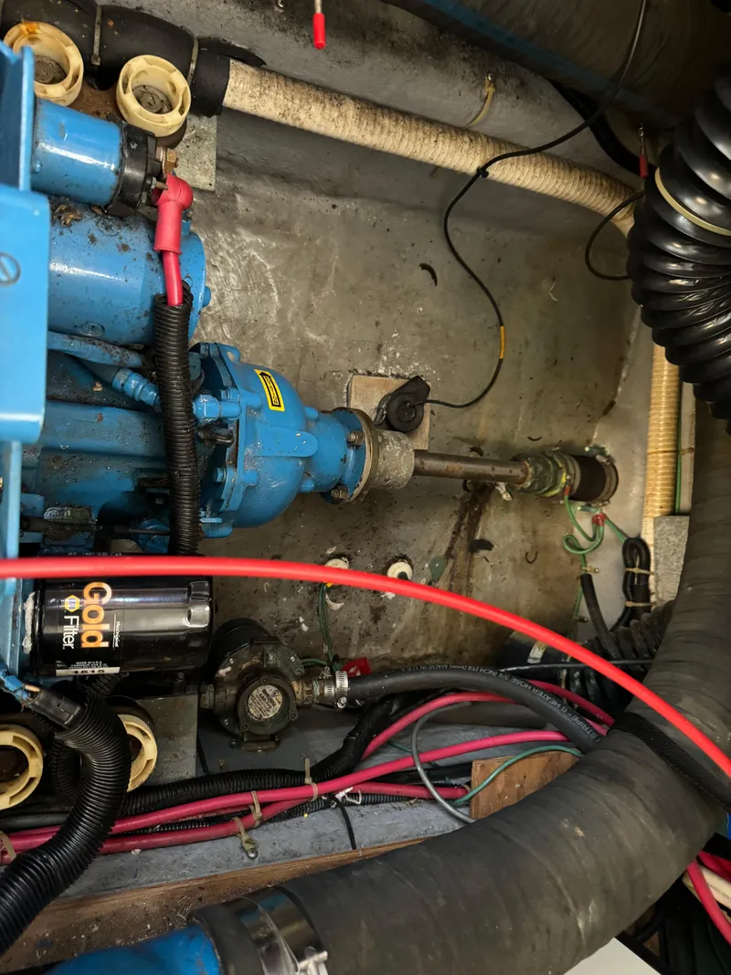 Slide: The Image of Engine compartment of a 1991 Carver 33 Aft Cabin boat with visible wiring and components. - 38