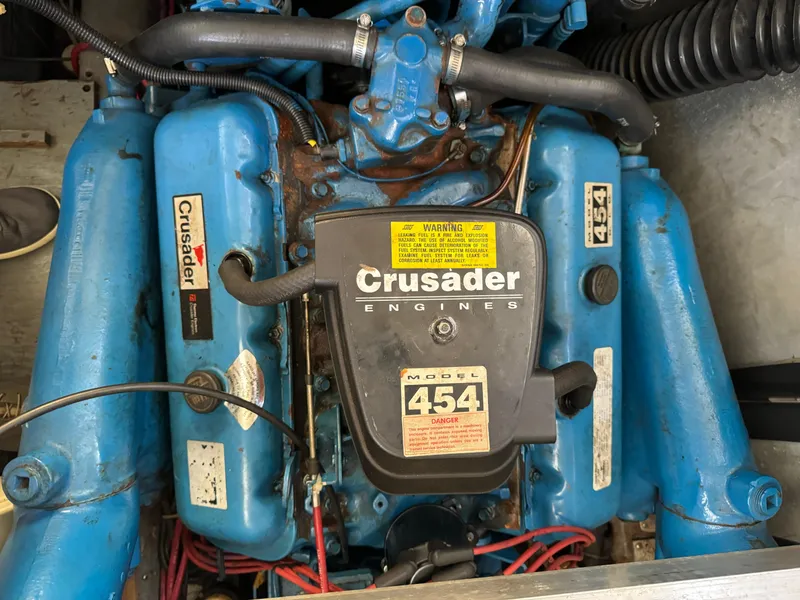 Slide: The Image of Crusader 454 engine in a 1991 Carver 33 Aft Cabin boat, blue components visible. - 39