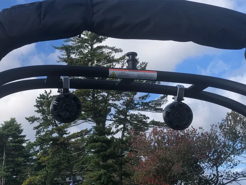 Slide: The Image of 2022 Tahoe 185 S boat speakers against a backdrop of trees and sky. - 6