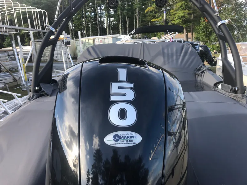 Slide: The Image of 2022 Tahoe 185 S boat with 150 horsepower engine, docked outdoors. - 8