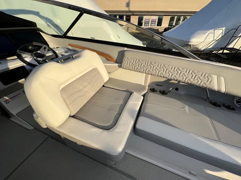 Slide: The Image of 2025 Regal LS9 boat interior with luxurious seating and modern design. - 11