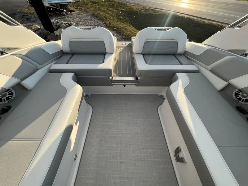 Slide: The Image of 2025 Regal LS9 boat interior with gray and white seating, modern design. - 6