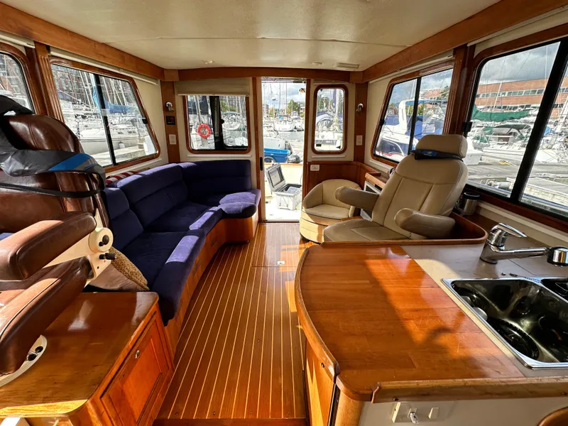 Slide: The Image of Luxurious interior of a 2005 Legacy 42 yacht with plush seating and wooden finishes. - 10