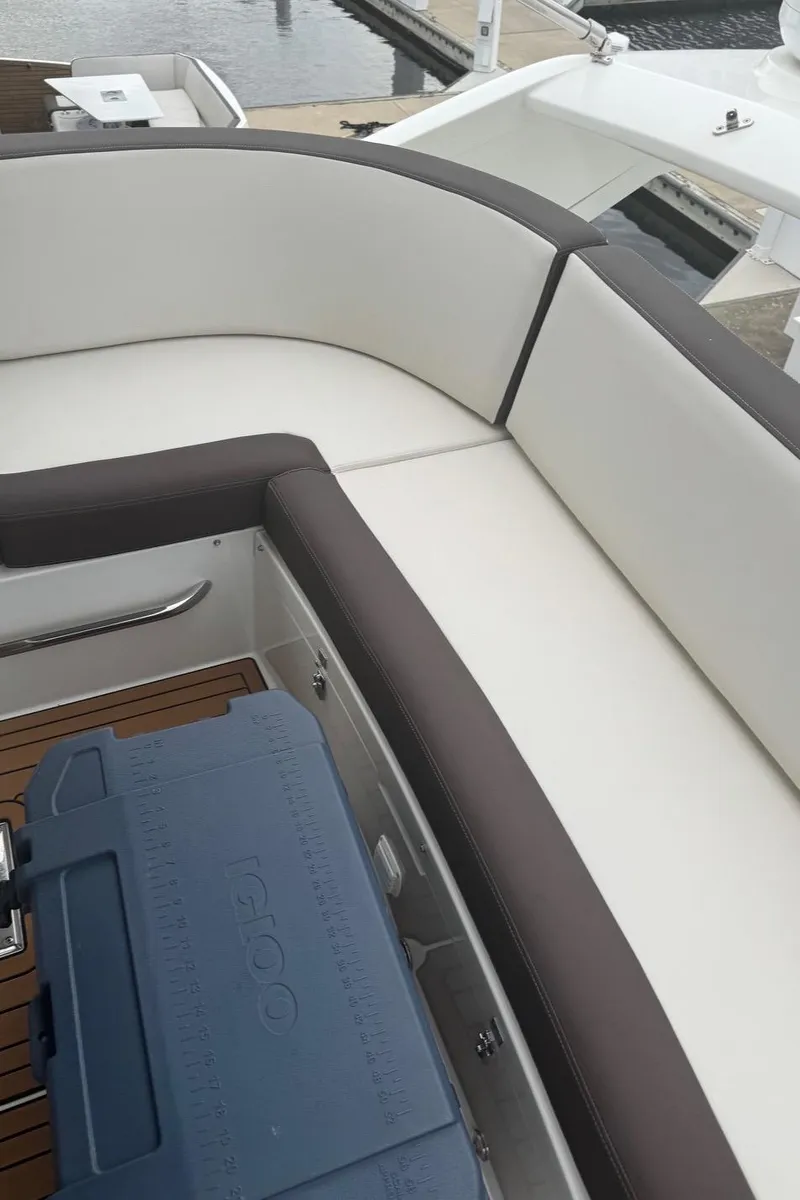 Slide: The Image of 2019 Galeon 500 Fly yacht seating area with cooler on deck. - 17