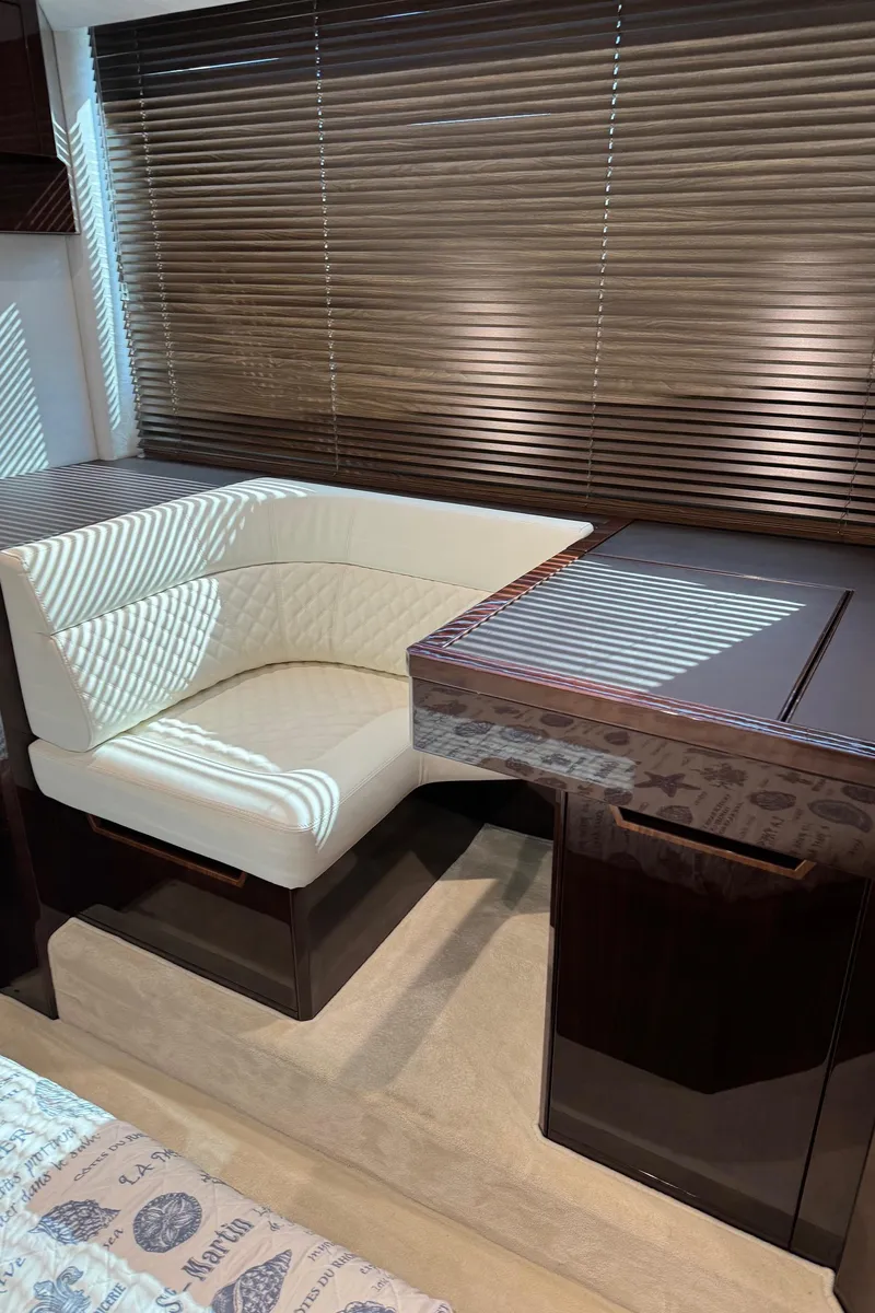 Slide: The Image of Luxurious interior of 2019 Galeon 500 Fly yacht with elegant seating and wooden blinds. - 25