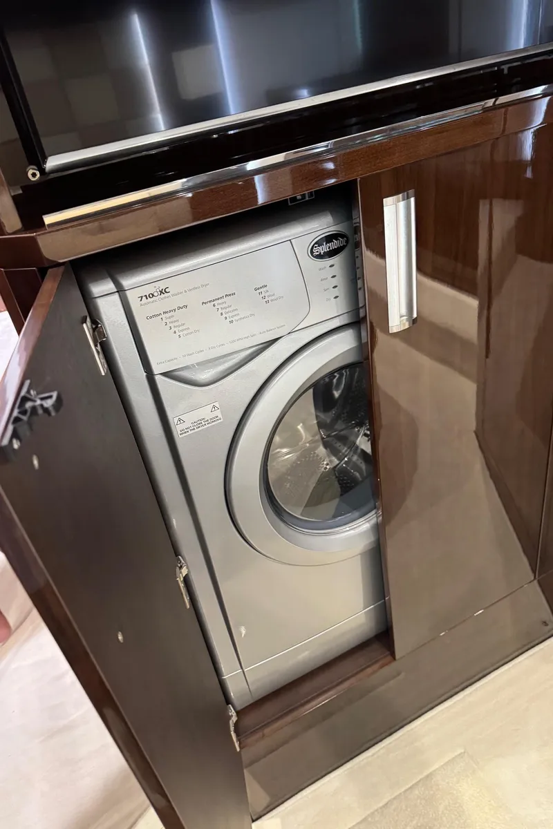 Slide: The Image of Washing machine inside a cabinet on a 2019 Galeon 500 Fly yacht. - 26