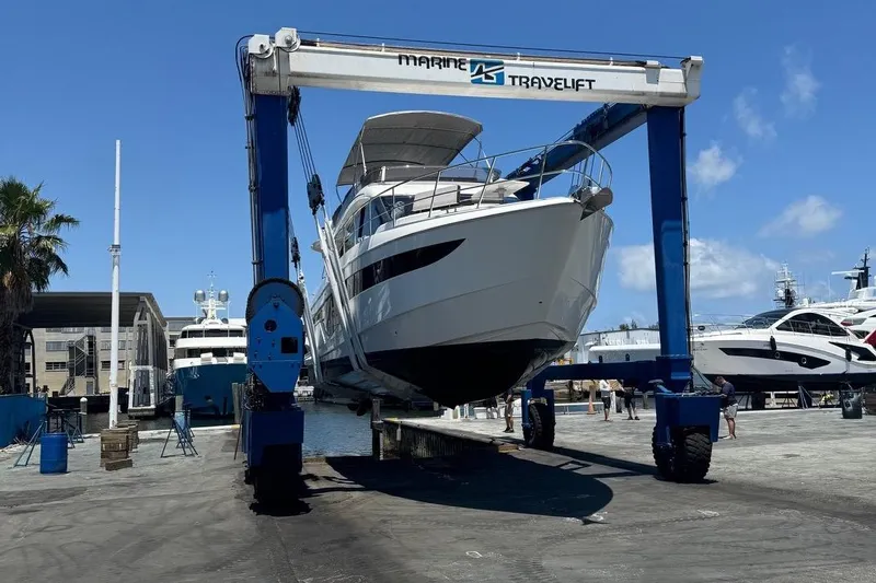 Slide: The Image of Galeon 500 Fly 2019 yacht on a marine travel lift at a shipyard. - 32