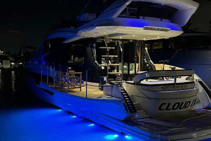 Slide: The Image of 2019 Galeon 500 Fly yacht with blue underwater lights at night. - 5