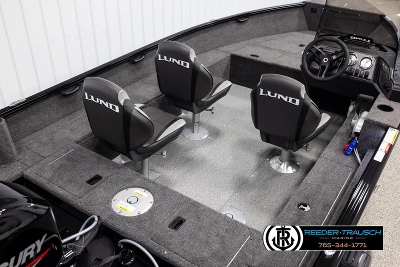 Slide: The Image of 2025 Lund 1650 Rebel XL SS boat interior with three seats and steering console. - 10