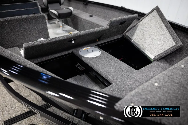 Slide: The Image of 2025 Lund 1650 Rebel XL SS boat interior with open storage compartments. - 14