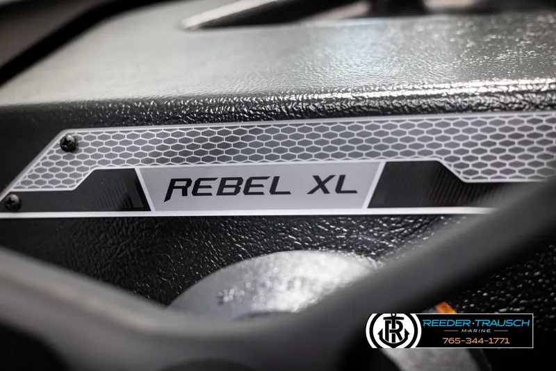 Slide: The Image of 2025 Lund 1650 Rebel XL SS boat dashboard with logo detail. - 23