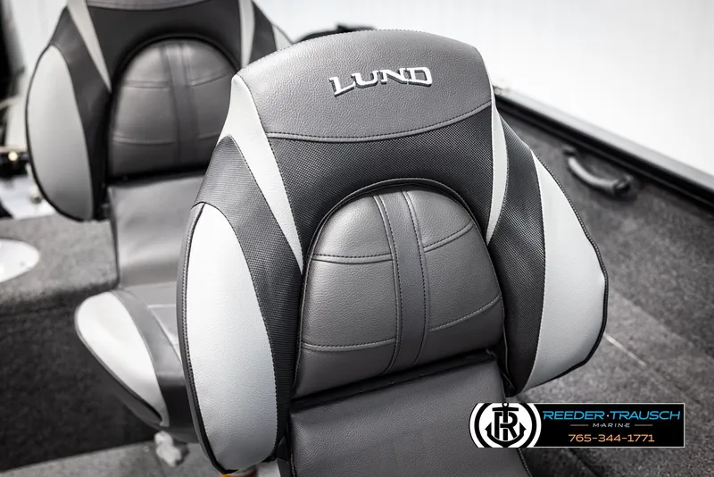 Slide: The Image of 2025 Lund 1650 Rebel XL SS boat seat, black and gray design, Reeder-Trausch Marine logo. - 24