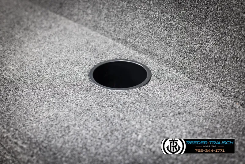 Slide: The Image of 2025 Lund 1650 Rebel XL SS boat interior with circular compartment. - 25