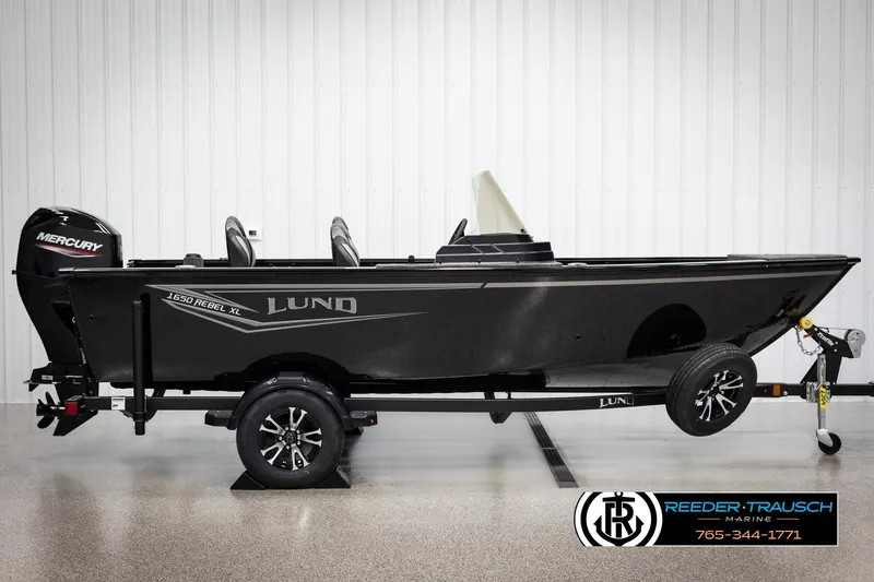 Slide: The Image of 2025 Lund 1650 Rebel XL SS boat on trailer, side view, black exterior. - 3
