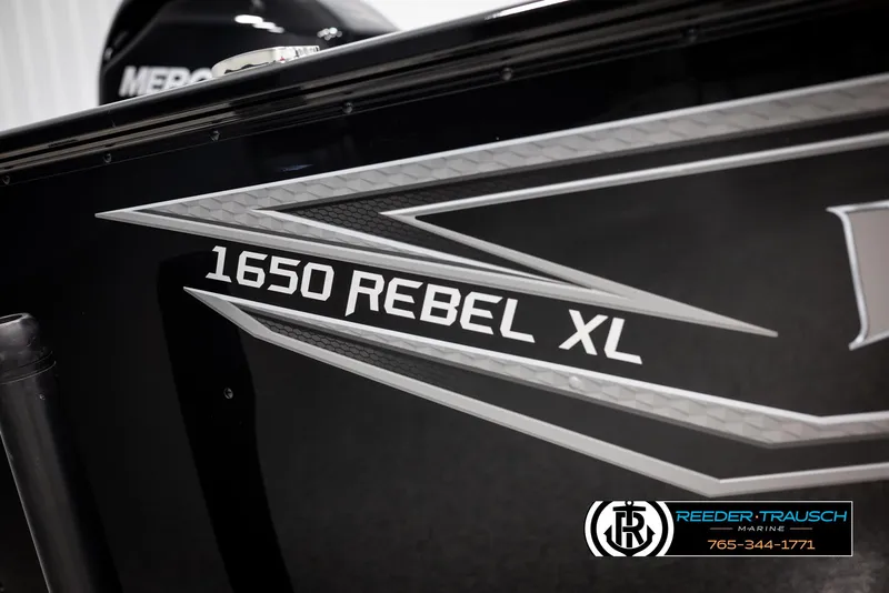 Slide: The Image of 2025 Lund 1650 Rebel XL SS boat with sleek design and branding. - 33