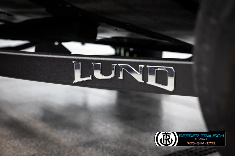 Slide: The Image of 2025 Lund 1650 Rebel XL SS boat trailer detail with logo. - 35
