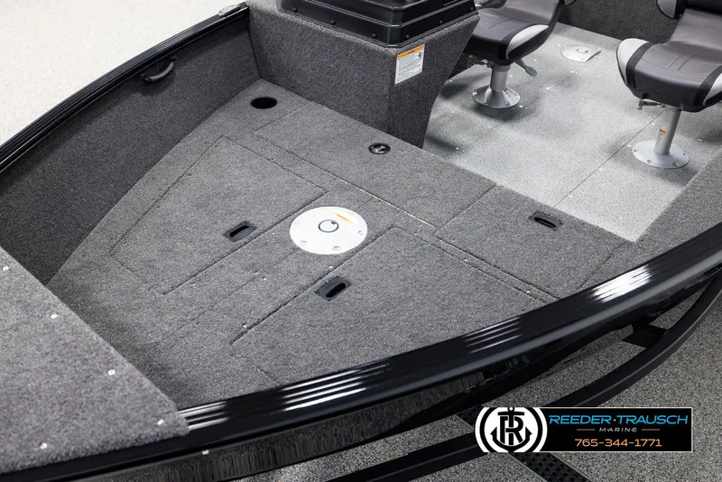 Slide: The Image of 2025 Lund 1650 Rebel XL SS boat interior with seating and storage compartments. - 8