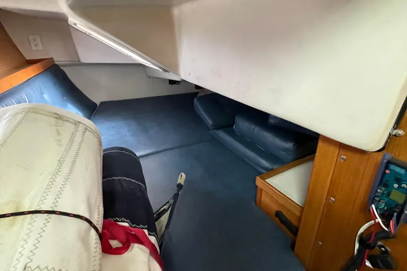 Slide: The Image of Interior cabin of 2002 Catalina 36 MkII sailboat, featuring seating and storage. - 21
