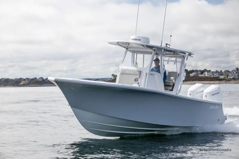 Slide: The Image of 2024 Onslow Bay 27XS boat cruising on open water. - 12