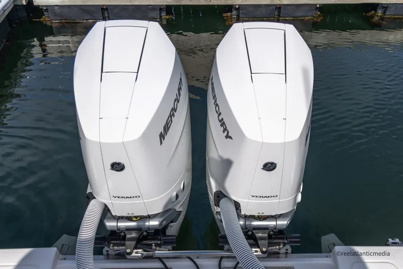 Slide: The Image of Twin Mercury outboard engines on a 2024 Onslow Bay 27XS boat. - 20