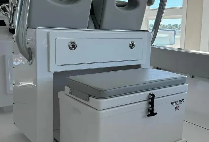 Slide: The Image of 2024 Onslow Bay 27XS boat interior with seating and storage compartment. - 22