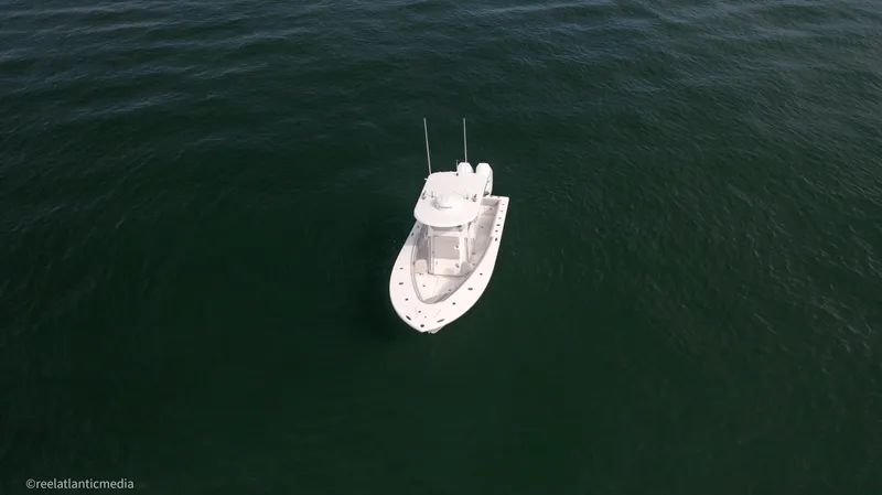 Slide: The Image of Aerial view of 2024 Onslow Bay 27XS boat on open water. - 26