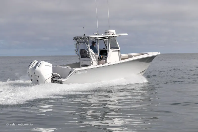 Slide: The Image of 2024 Onslow Bay 27XS boat cruising on open water. - 29
