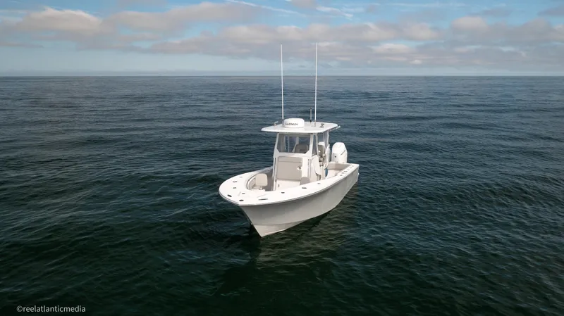 Slide: The Image of 2024 Onslow Bay 27XS boat on open ocean under blue sky. - 31