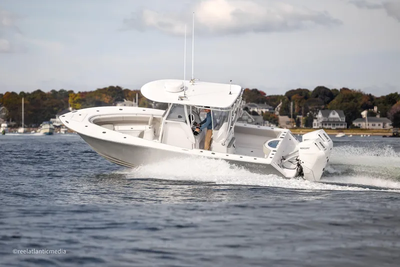 Slide: The Image of 2024 Onslow Bay 27XS boat cruising on water, showcasing sleek design and powerful performance. - 4