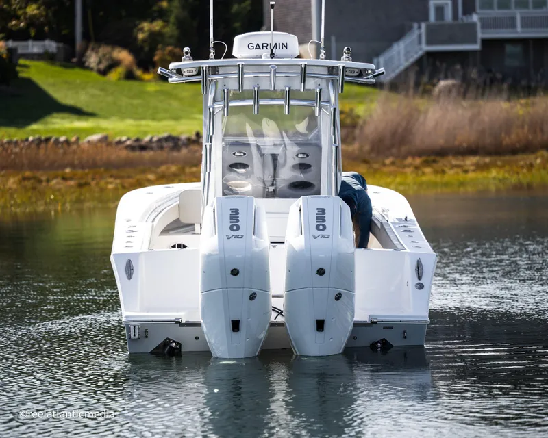 Slide: The Image of 2024 Onslow Bay 27XS boat with dual engines on water. - 7