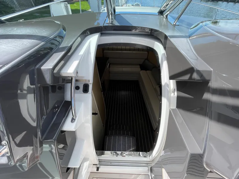 Slide: The Image of Entrance to cabin of 2016 Monterey 335 Sport Yacht, featuring sleek interior design. - 13