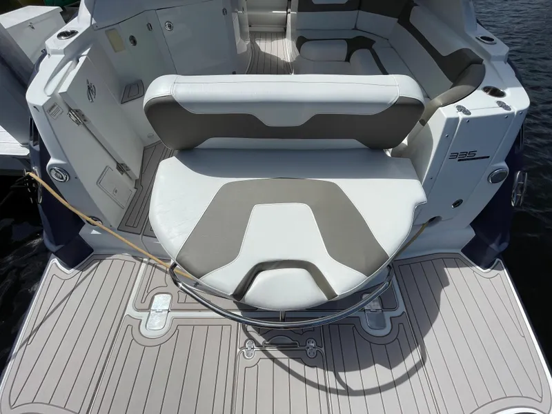 Slide: The Image of 2016 Monterey 335 Sport Yacht interior with cushioned seating and sleek design. - 2